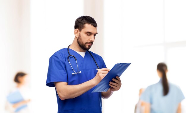 male-doctor-writing-medical-report-clipboard_380164-268329